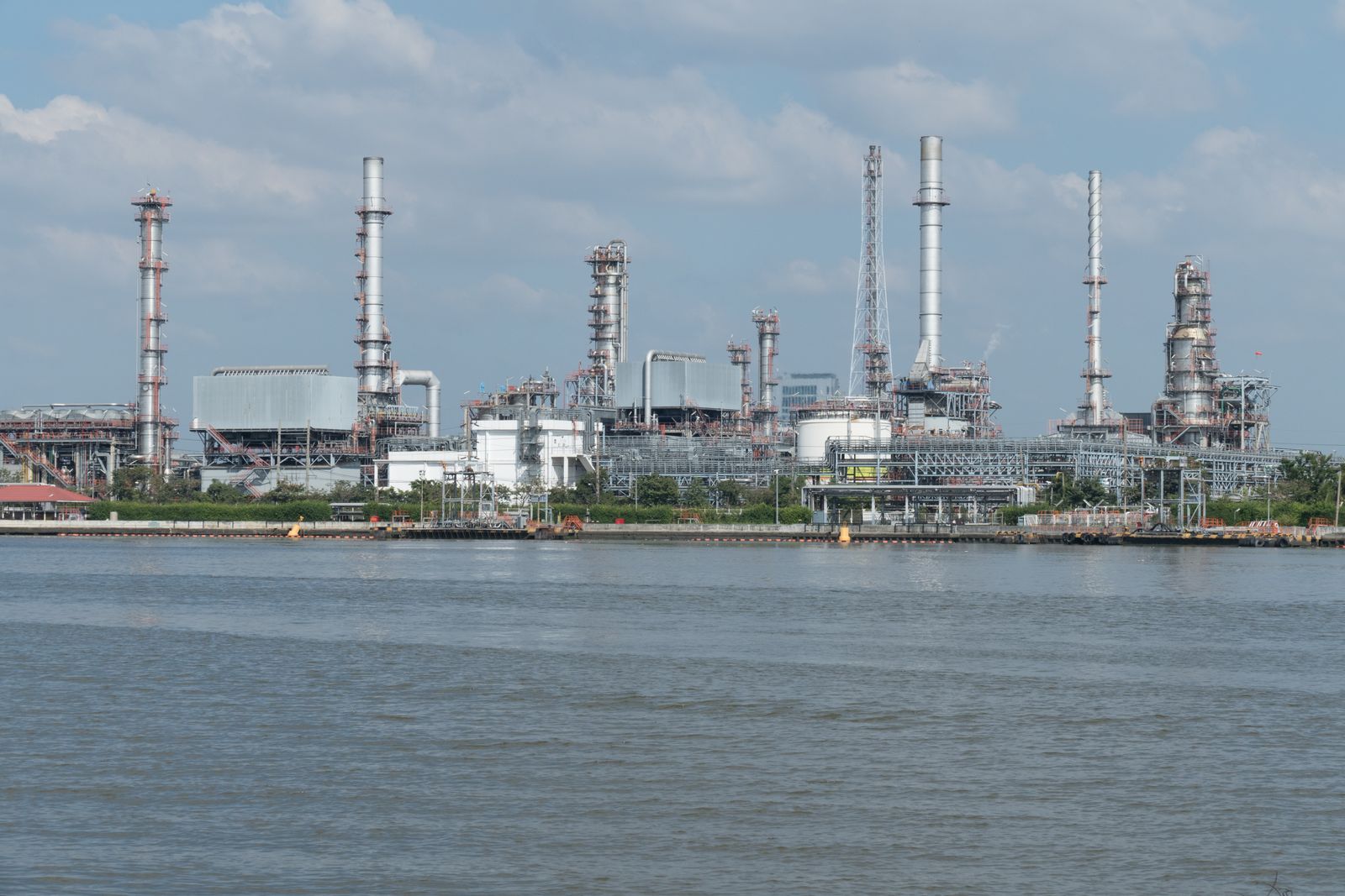 Large energy processing facility with industrial structures and pipework